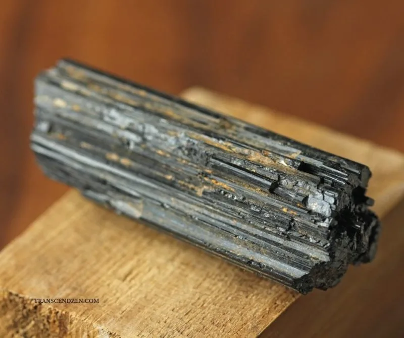raw-black-tourmaline-on-wood