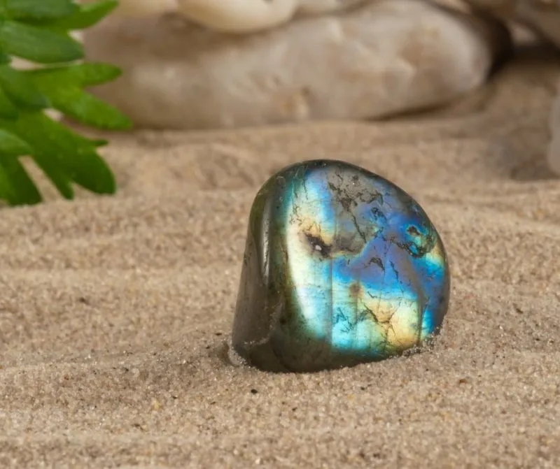 polished labradorite on sand