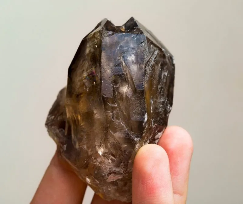 smoke quartz in fingers